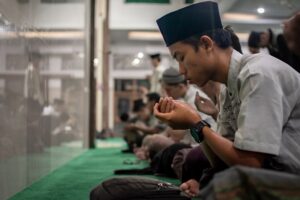 muslim man in mosque listening to adhan